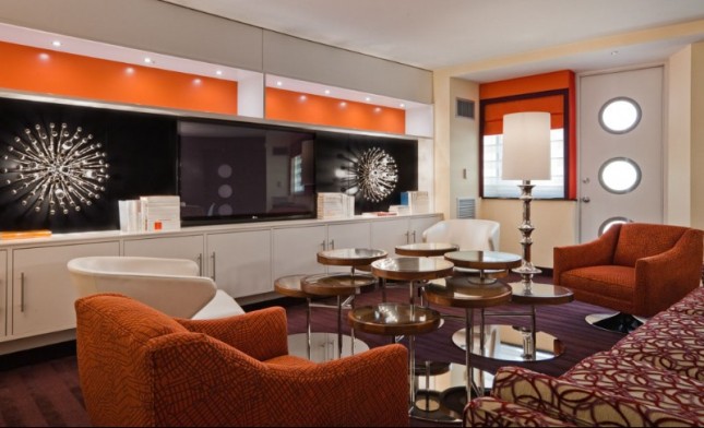 A hotel lobby with seating and tables