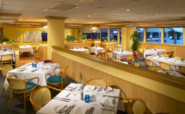 A restaurant dining area with tables set for meals.